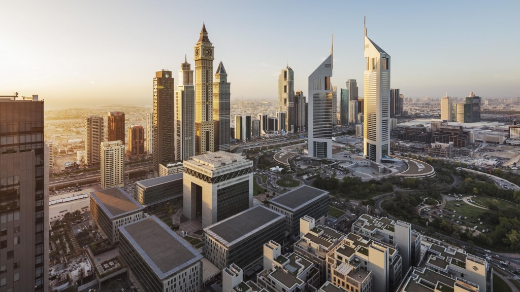 Aerial view of Dubai International Financial Centre (DIFC) skyline at sunset, highlighting its iconic skyscrapers.