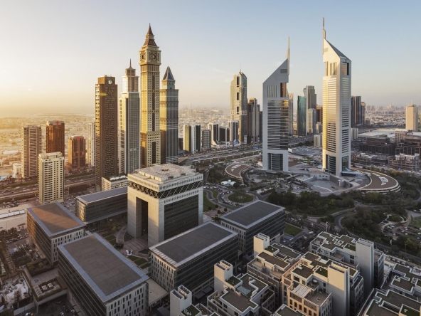 Aerial view of Dubai International Financial Centre (DIFC) skyline at sunset, highlighting its iconic skyscrapers.